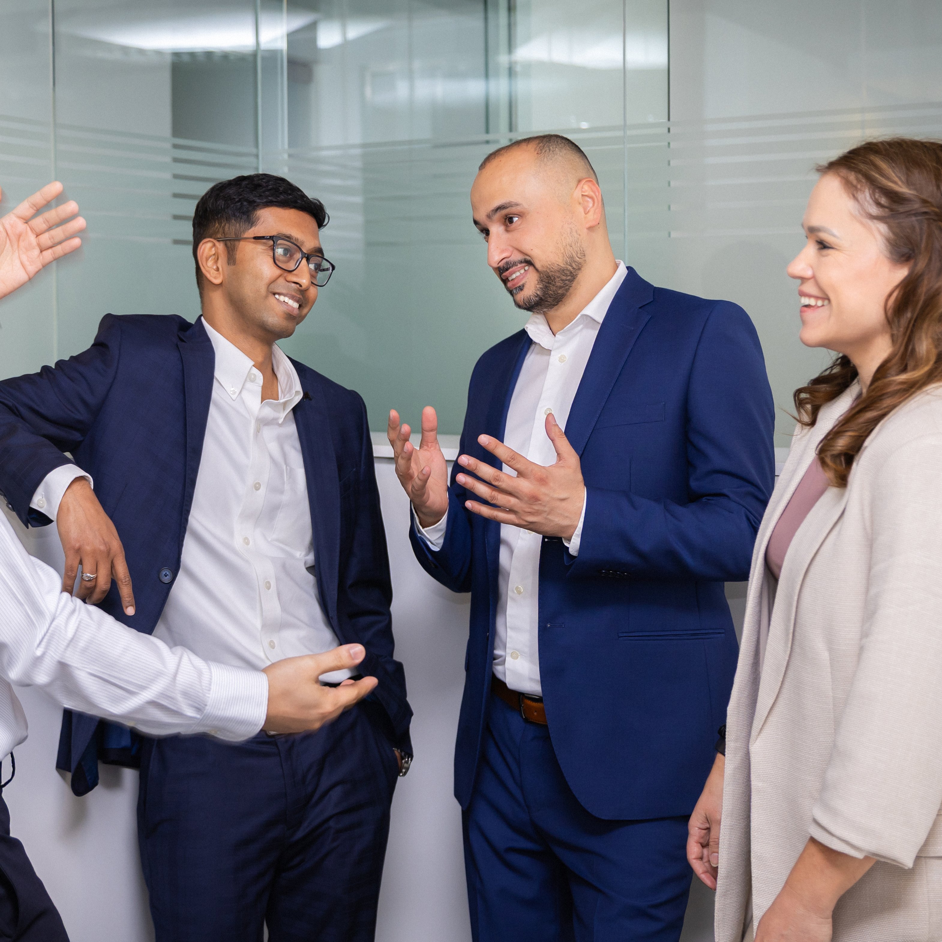 Four colleagues discussing ideas.