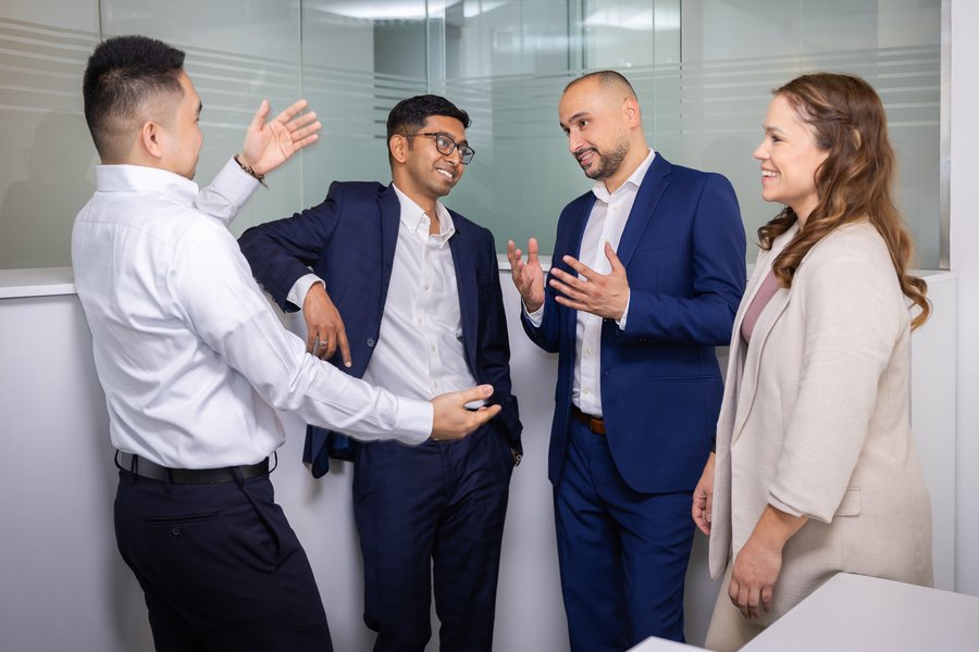 Four colleagues discussing ideas.
