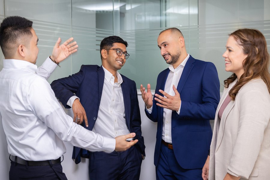 Four colleagues discussing ideas.