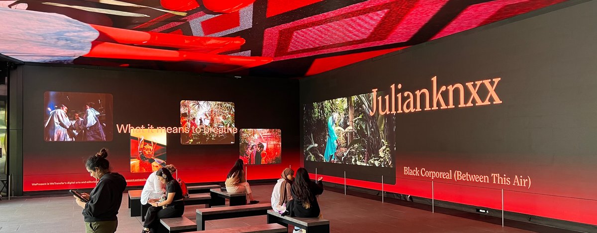 Art-Installation-Outernet.jpg Visitors viewing an immersive video installation in a modern exhibition space.