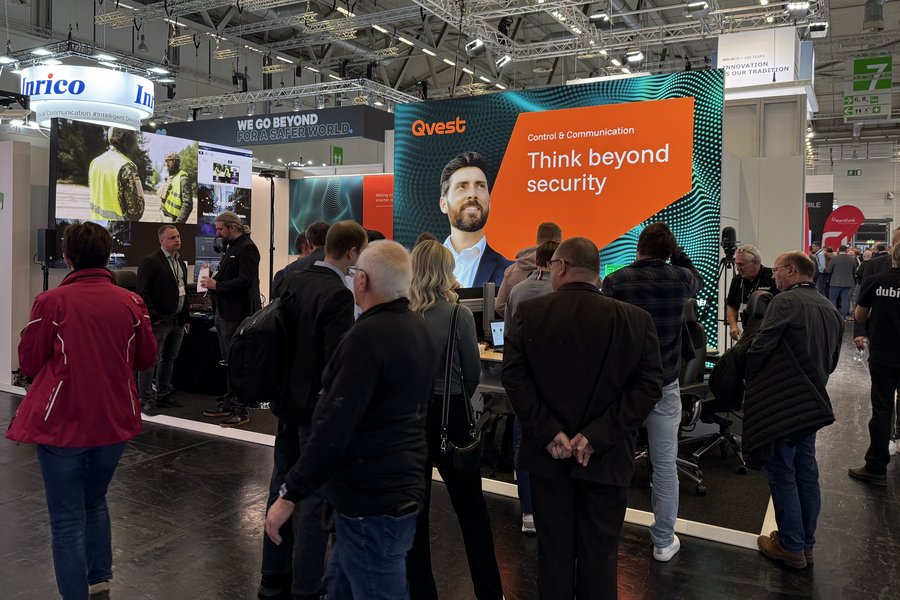 Crowd of attendees at the Qvest booth at PMRExpo 2025.