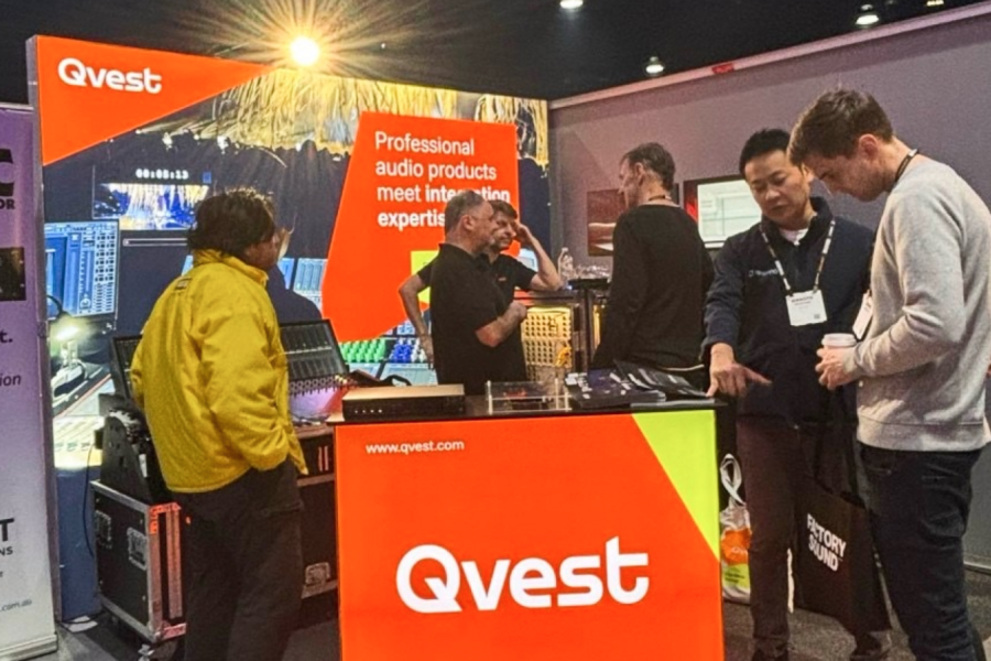People at a trade show booth.
