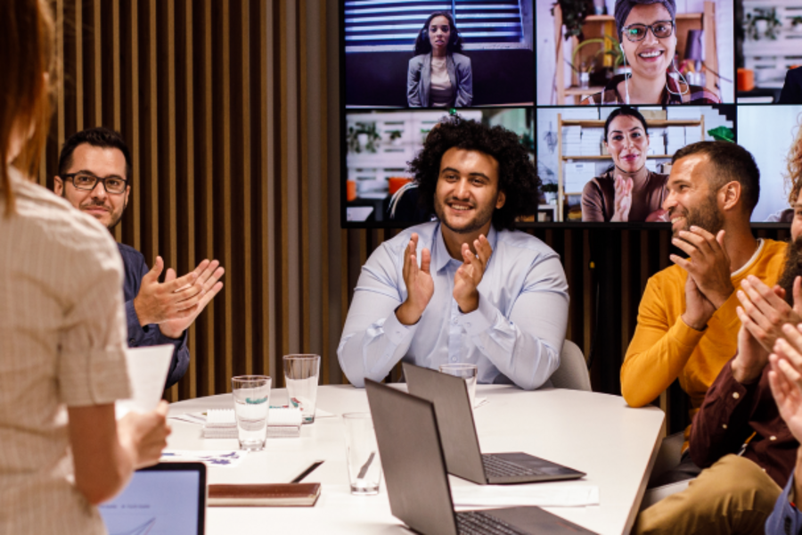 Meeting with participants applauding.