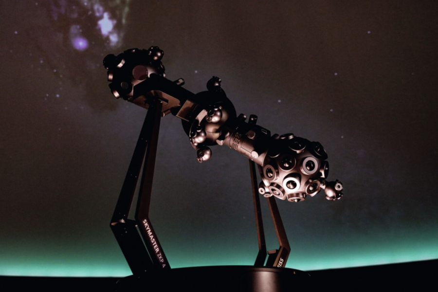 Telescope in a planetarium setting.