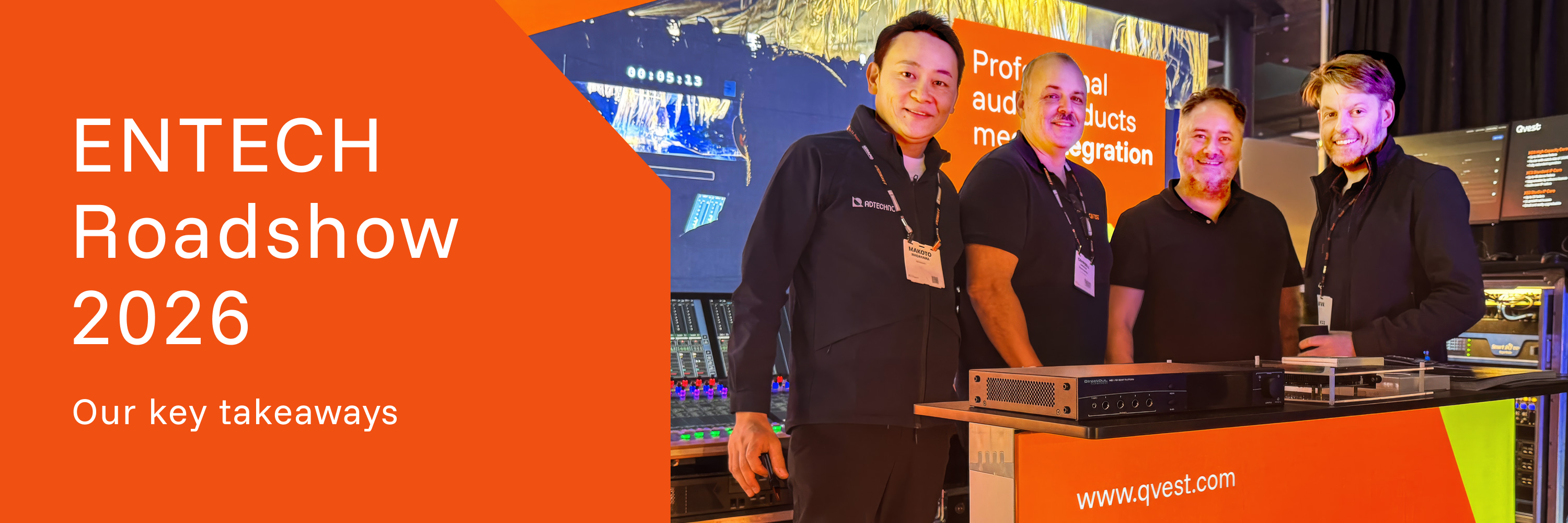 Four people at an audio products booth.