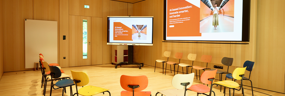 Empty meeting room with colorful chairs.