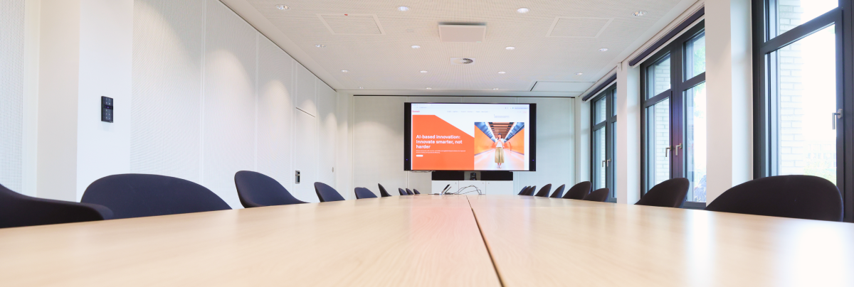 Modern novitas conference room with a screen.